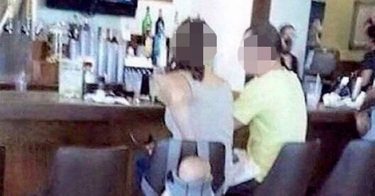 Woman blasted for 'hanging baby from bar stool as she carried on drinking'
