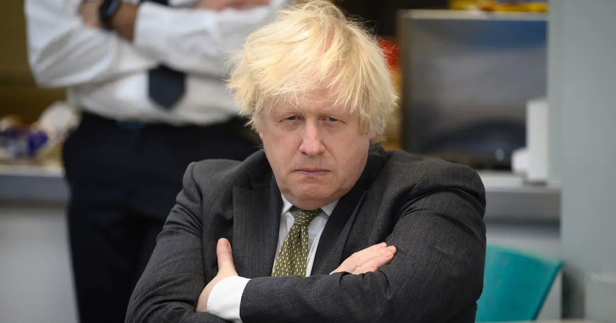 'Boris Johnson was ambushed with a cake' during alleged lockdown party says Tory MP