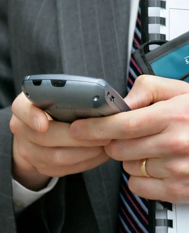 A BlackBerry user checks his screen in Washington, Wednesday, April 18, 2007.
