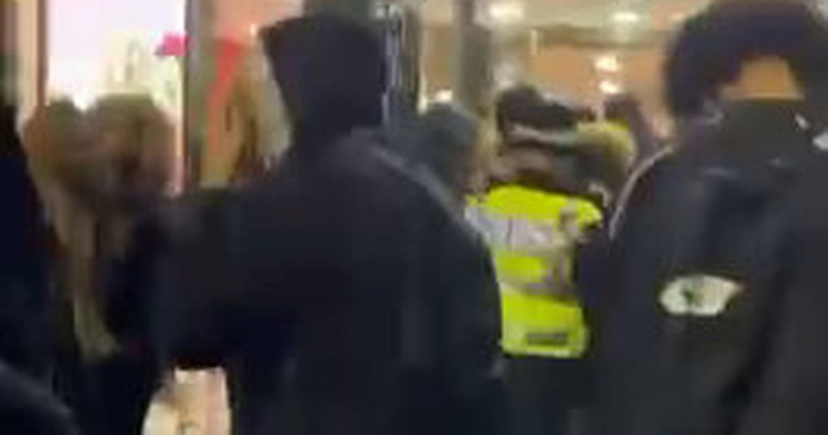 Crowd flees packed McDonald's as 'gunshot' heard during mass brawl