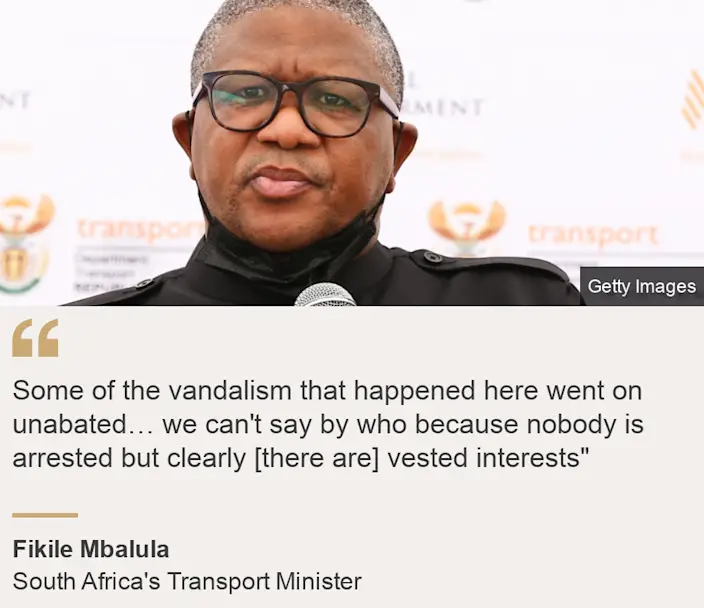 "Some of the vandalism that took place here continued unabated"  we can't say by whom, because no one has been arrested, but clearly [there are] vested interests""Source: Fikile Mbalula, Source description: Minister of Transport of South Africa, Image: Fikile Mbalula