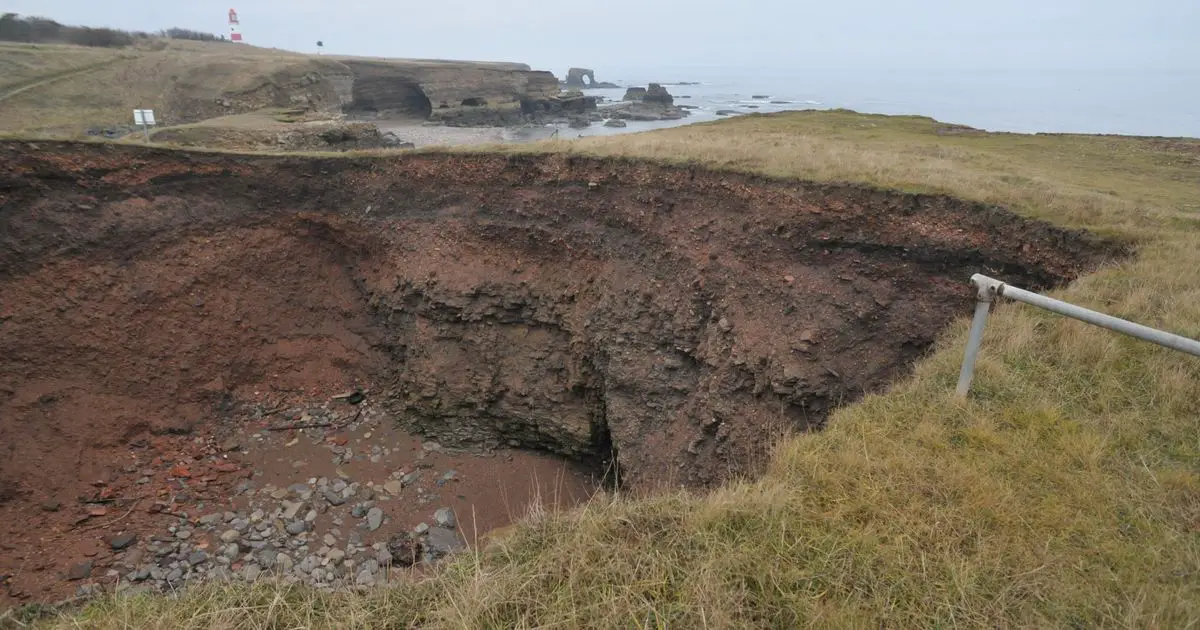Huge 40ft sinkhole on sea clifftop exposes hidden underground beach
