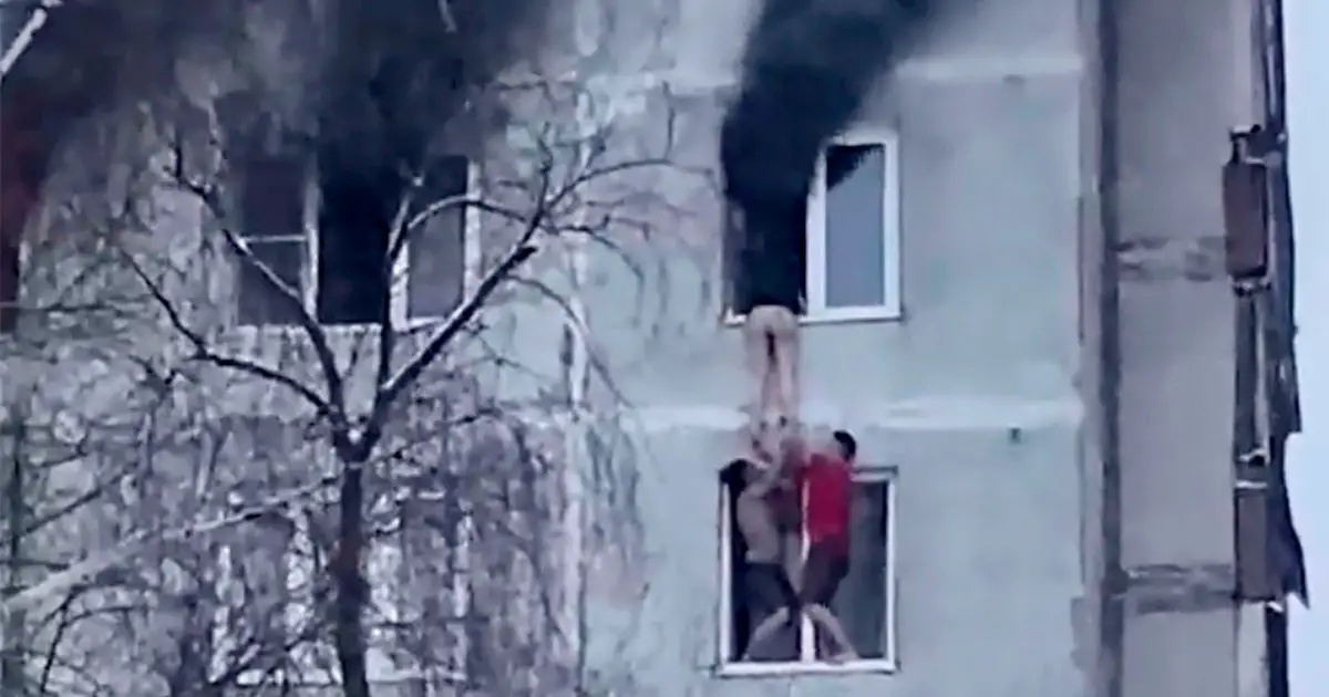Terrifying footage shows rescue of teen from 90ft high burning flat
