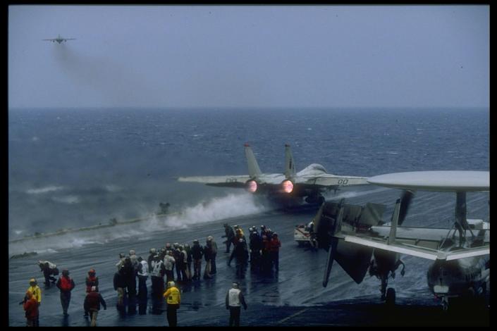 Navy F-14 Tomcat takes off from aircraft carrier USS Forrestal