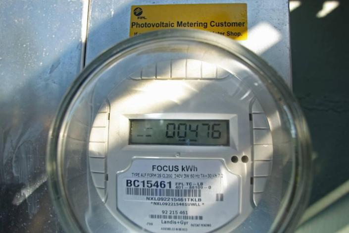 FPL meter on a house in Broward County shows usage and amount generated by solar panels.