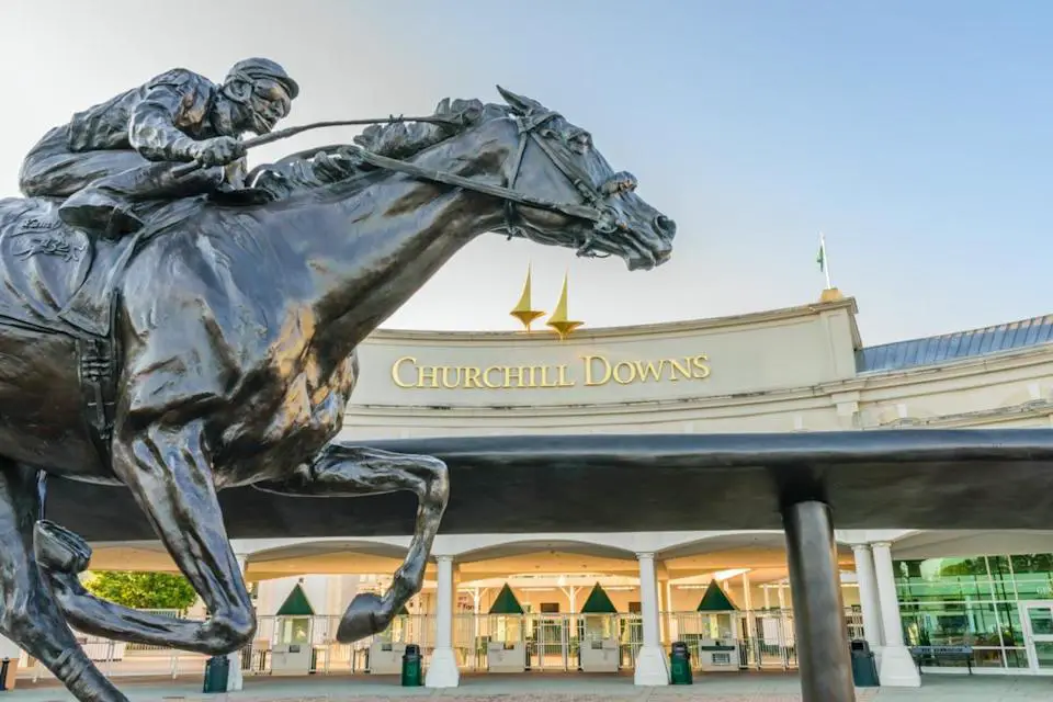 LOUISVILLE, KENTUCKY, USA - MAY 15 2016: Entrance to Churchill Downs featuring a statue of 2006 Kentucky Derby Champion Barbara.
