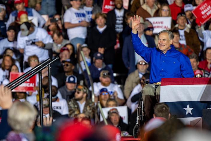 Texas Gov. Greg Abbott waves to supporters at a campaign rally.
