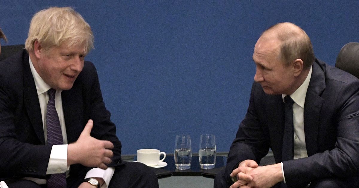 Boris Johnson has issued a warning to Vladimir Putin, right