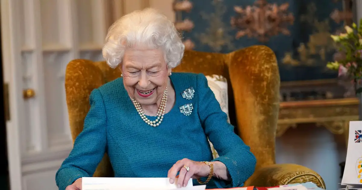 Queen in touching nod to beloved 'papa' as she browses Jubilee memorabilia