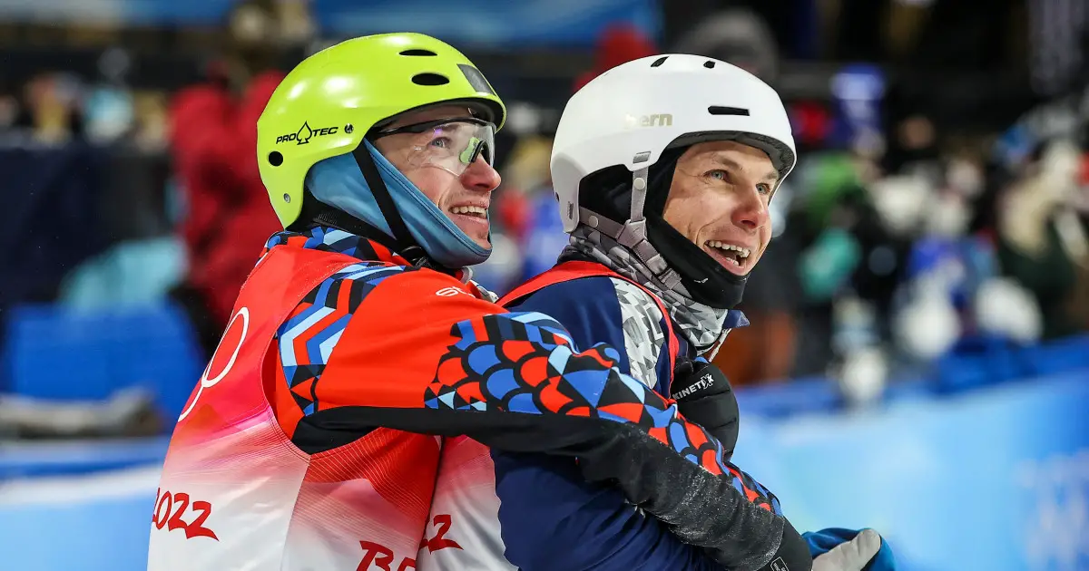 Ukrainian and Russian celebrate medals with hug at Olympics