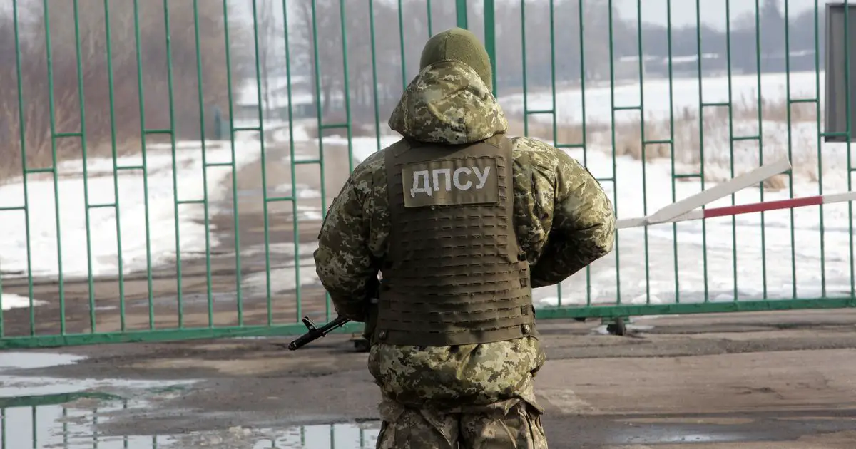 A border guard is on duty at the Zhuravlivka checkpoint on the Ukraine-Russia border